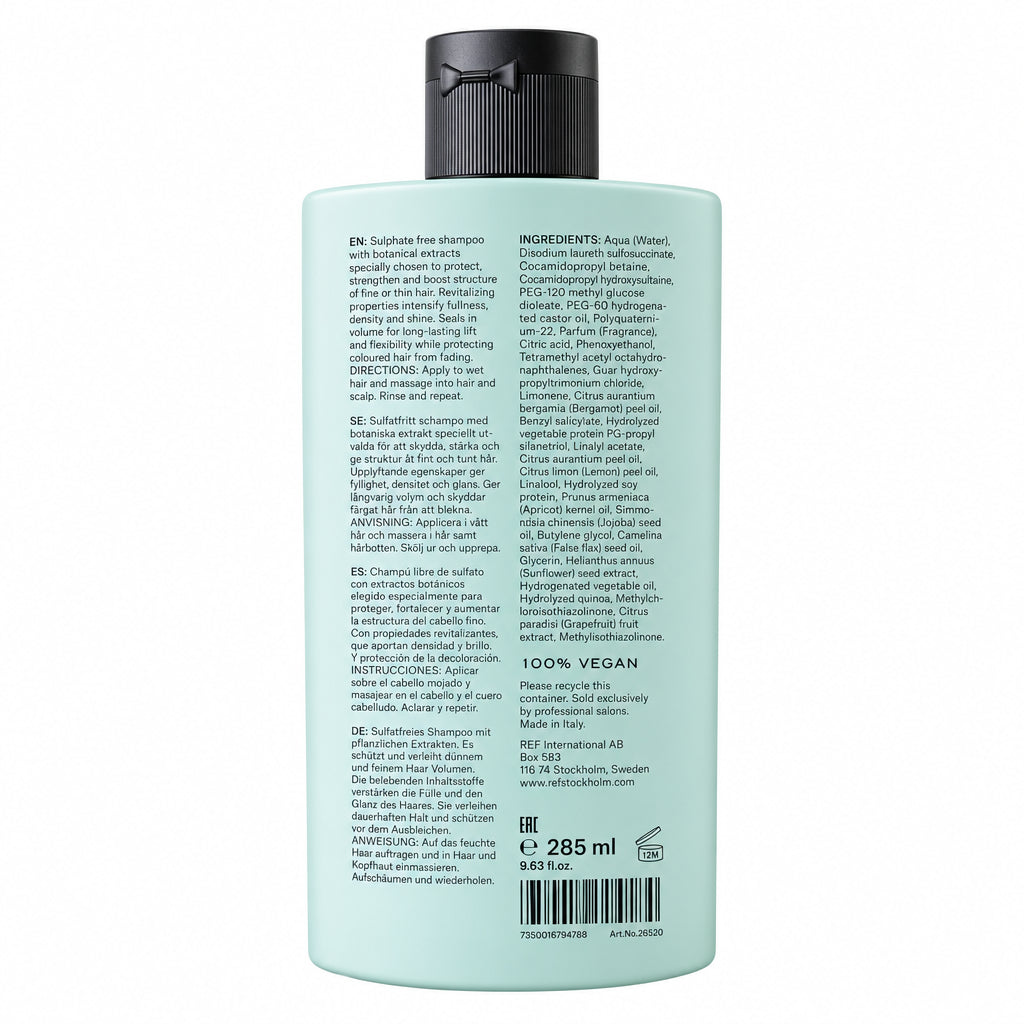 A 285 ml bottle of shampoo shown from the back, featuring a pale mint green body and a black ribbed cap, with detailed product text printed on the side.